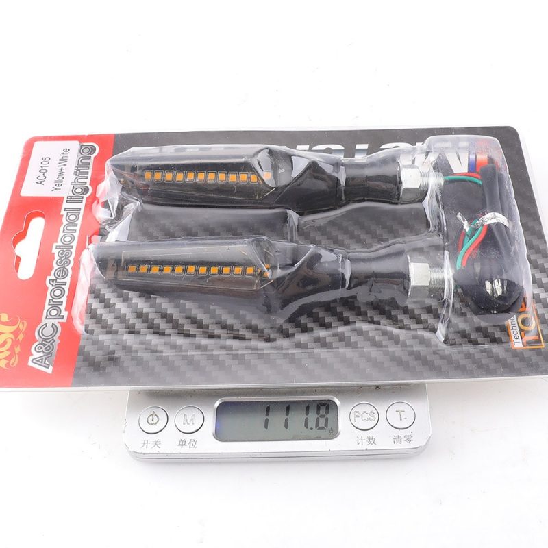 Packing image showing AC-0105 yellow plus white reference and 111.8 g scale reading; confirm final packing weight by batch.
