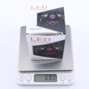 Led Kaleidoscope Motorcycle Flashing Brake Light Packing Weight Packing reference showing motorcycle brake bulb box and 68.0 g scale reading; confirm final packing weight by batch.