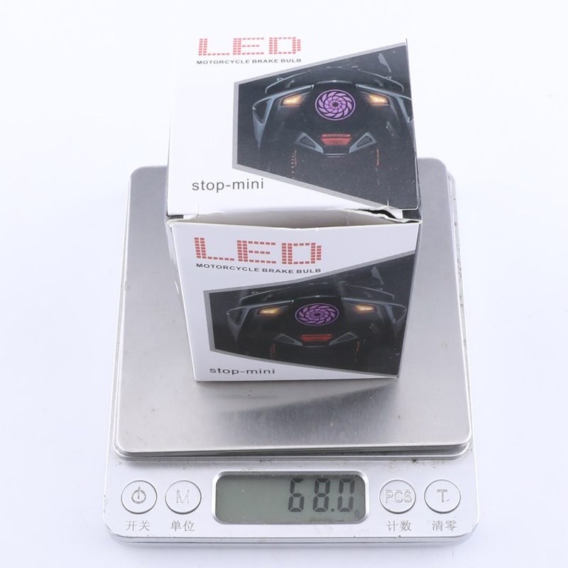 Led Kaleidoscope Motorcycle Flashing Brake Light Packing Weight Packing reference showing motorcycle brake bulb box and 68.0 g scale reading; confirm final packing weight by batch.